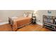 Cozy bedroom with hardwood floors and ample storage and display shelving at 2714 W Jetton Ave, Tampa, FL 33629