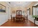 Formal dining room with hardwood floors, a china cabinet and elegant chandelier at 2714 W Jetton Ave, Tampa, FL 33629