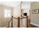 Hallway showcasing the staircase, wooden floors, and neutral wall color at 2714 W Jetton Ave, Tampa, FL 33629