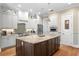 Gourmet kitchen featuring stainless appliances, granite counters, and custom cabinetry at 2714 W Jetton Ave, Tampa, FL 33629