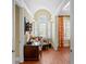 Bright office featuring hardwood floors, large windows with shutters, and arched ceiling at 2714 W Jetton Ave, Tampa, FL 33629