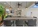 Well-equipped outdoor kitchen with a granite counter, built-in grill, and marine-themed decor at 2714 W Jetton Ave, Tampa, FL 33629