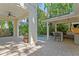 Inviting outdoor living space with a covered patio, outdoor kitchen, and lush tropical landscaping at 2714 W Jetton Ave, Tampa, FL 33629