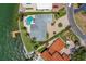 An aerial view reveals a pool and dock for this waterfront home at 2788 70Th S Ave, St Petersburg, FL 33712