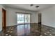 Bright bedroom with sliding glass door to patio, view of pool, and closet space at 2788 70Th S Ave, St Petersburg, FL 33712