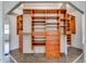 Spacious closet with mirrored doors and custom wood shelves and drawers for optimal storage organization at 2788 70Th S Ave, St Petersburg, FL 33712