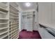 Walk-in closet with custom shelving and ample storage space at 2788 70Th S Ave, St Petersburg, FL 33712