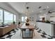 Bright dining room with modern light fixture, checkered flooring and views of the ocean at 2788 70Th S Ave, St Petersburg, FL 33712