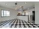 Bright open dining room featuring a black and white checkerboard floor design and access to waterfront views at 2788 70Th S Ave, St Petersburg, FL 33712