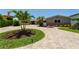 Beautiful single-story home has lush landscaping and a circular driveway at 2788 70Th S Ave, St Petersburg, FL 33712