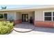 Home's front entrance with brick accents, a double door entry, and neutral tones at 2788 70Th S Ave, St Petersburg, FL 33712
