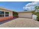 A paved driveway leads to a two-car garage with lush landscaping at 2788 70Th S Ave, St Petersburg, FL 33712