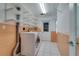 Functional laundry room with shelving, washer, dryer, and easy access to the outside at 2788 70Th S Ave, St Petersburg, FL 33712