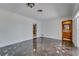 Bright living room with marble floors and entry to bathroom with decorative wall features at 2788 70Th S Ave, St Petersburg, FL 33712