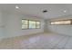 Bright living room featuring tile floors, neutral paint, and natural light from the exterior windows at 2788 70Th S Ave, St Petersburg, FL 33712