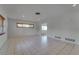 Spacious living room showcasing tile flooring, neutral wall paint, and access to water views at 2788 70Th S Ave, St Petersburg, FL 33712