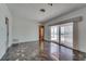 Bright living room with marble floors and sliding glass doors to the pool area at 2788 70Th S Ave, St Petersburg, FL 33712