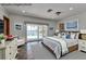 Staged main bedroom with water views, complemented by stylish furnishings and decor at 2788 70Th S Ave, St Petersburg, FL 33712