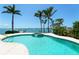 Gorgeous backyard pool with waterfront view and mature palm trees at 2788 70Th S Ave, St Petersburg, FL 33712