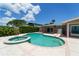 Enjoy the outdoors in this backyard pool with spa, set amongst lush landscaping and clear blue skies at 2788 70Th S Ave, St Petersburg, FL 33712