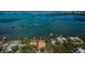 Stunning aerial view of waterfront homes and docks surrounded by beautiful blue water and lush greenery at 2834 Pelham N Rd, St Petersburg, FL 33710