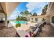 An appealing back patio with a pool and multiple seating and lounge options at 2834 Pelham N Rd, St Petersburg, FL 33710