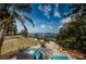 A tranquil backyard featuring lounge seating and views of the ocean at 2834 Pelham N Rd, St Petersburg, FL 33710