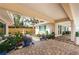 Backyard patio area with lush landscaping, beautiful plants, and access to water views at 2834 Pelham N Rd, St Petersburg, FL 33710