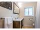 Bathroom features a modern vanity with double sinks, a large mirror, and great lighting at 2834 Pelham N Rd, St Petersburg, FL 33710