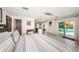 Open concept bedroom with tile floors, walk-in shower, and access to a pool and patio area at 2834 Pelham N Rd, St Petersburg, FL 33710