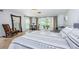 Relaxing bedroom with waterfront views and sliding glass doors to the outdoors at 2834 Pelham N Rd, St Petersburg, FL 33710