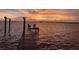 Private wooden dock with chairs for relaxing and enjoying the sunset over the water at 2834 Pelham N Rd, St Petersburg, FL 33710