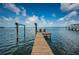 A private wooden dock with two adirondack chairs overlooking ocean views at 2834 Pelham N Rd, St Petersburg, FL 33710