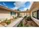 Well-maintained exterior with lush landscaping and inviting walkway to the home and courtyard pool at 2834 Pelham N Rd, St Petersburg, FL 33710