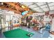 Spacious garage with laundry, exercise equipment, storage, and epoxy floor at 2834 Pelham N Rd, St Petersburg, FL 33710