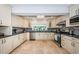 Well-equipped kitchen with sleek countertops, backsplash and stainless steel appliances at 2834 Pelham N Rd, St Petersburg, FL 33710