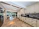 Modern kitchen open to living spaces with water views at 2834 Pelham N Rd, St Petersburg, FL 33710
