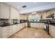 Charming kitchen featuring sleek appliances, custom cabinetry, and ample countertop space at 2834 Pelham N Rd, St Petersburg, FL 33710