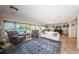 Sunlit living room with comfortable seating, water views, and open layout at 2834 Pelham N Rd, St Petersburg, FL 33710
