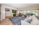 Inviting living room with plush seating, large rug, and water views at 2834 Pelham N Rd, St Petersburg, FL 33710
