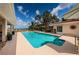 Inviting pool with lush landscaping and serene water views at 2834 Pelham N Rd, St Petersburg, FL 33710