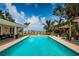 Private backyard pool with inviting lounge area and serene water views at 2834 Pelham N Rd, St Petersburg, FL 33710