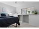 Bright bedroom with built-in storage under window and neutral color scheme at 3137 Mission Grove Dr # 3137, Palm Harbor, FL 34684