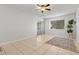 The main bedroom features tile flooring, ample natural light, and a sliding door to the lanai at 3137 Mission Grove Dr # 3137, Palm Harbor, FL 34684