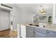 Kitchen with granite countertops and view into the living room at 3137 Mission Grove Dr # 3137, Palm Harbor, FL 34684