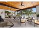 Enclosed patio featuring ample seating, ceiling fans and views of community pool at 3137 Mission Grove Dr # 3137, Palm Harbor, FL 34684