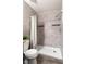 Bathroom featuring tiled shower with rainfall showerhead and built in shelving at 3137 Mission Grove Dr # 3137, Palm Harbor, FL 34684