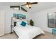 Bright bedroom with vaulted ceiling, ample natural light and blue accents at 3342 Waterford Dr, Clearwater, FL 33761
