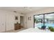 Main bedroom boasts natural light, closet, dresser and sliding glass door overlooking pool at 3342 Waterford Dr, Clearwater, FL 33761