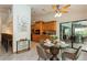 Eat-in kitchen dining area is open to the kitchen and includes a sliding glass door to the pool at 3342 Waterford Dr, Clearwater, FL 33761